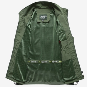 Detail of army green outdoor vest showing breathable mesh lining and brand label