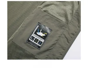 Detail of army green fishing vest featuring breathable mesh lining and inner pocket