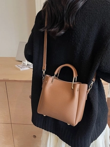 Chic camel lychee pattern leather bucket bag with metal handles and adjustable strap
