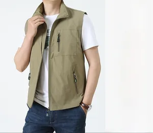 Detail of khaki outdoor vest with stand collar, full zipper, and multiple utility pockets