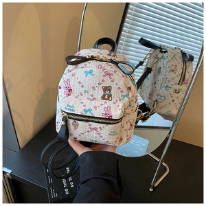 Détails du mini sac à dos avec motifs de dessins animés et fermetures éclair dorées