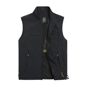 Detail of black outdoor vest showing breathable mesh lining and orange zipper pulls