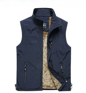 Close-up of navy blue outdoor vest featuring fleece lining and embroidered chest logo
