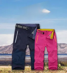 Detail of couple's quick-dry shorts with adjustable woven belts and zipper pockets