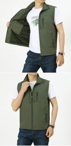 Detail view of army green outdoor vest showing zipper pockets and breathable mesh lining