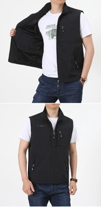 Detail of black tactical vest featuring multi-pocket design and breathable mesh lining