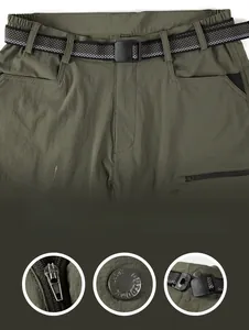 Detailed view of quick-dry shorts waist with black belt and durable metal zipper fly