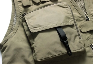 Detail of multi-pocket fishing vest showing metal zipper and durable mesh fabric
