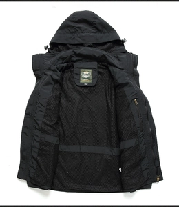 Close-up of men's black windbreaker featuring breathable mesh lining and adjustable hood