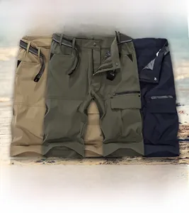 Flat lay of quick-dry outdoor cargo shorts in green, khaki, and navy with belts