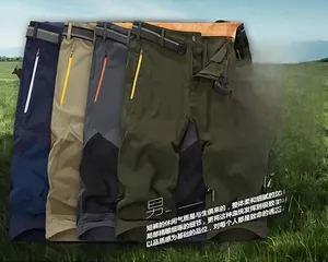 Detail showing quick-dry fabric texture and contrast color zipper pockets on sports shorts