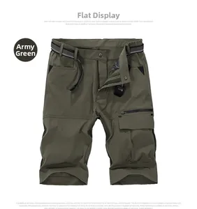 Detailed flat lay of army green outdoor cargo shorts with belt and tactical utility pockets