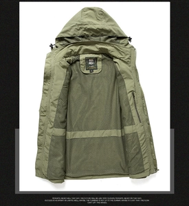 Detail view of the breathable mesh lining and interior pocket of the army green jacket