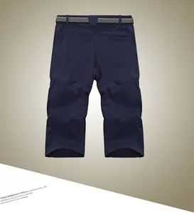 Rear view of dark blue quick-dry sports shorts featuring an adjustable woven waist belt