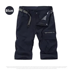 Detail of navy blue quick-dry outdoor shorts with zipper pockets and canvas belt