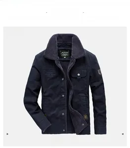 Detail of navy blue winter jacket with warm fleece collar and chest lettering logo