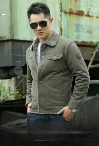 Detail of army green winter jacket with plush faux fur lining and utility pockets