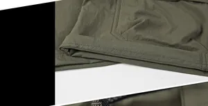 Detailed close-up of precise double-needle stitching on military green quick-dry shorts