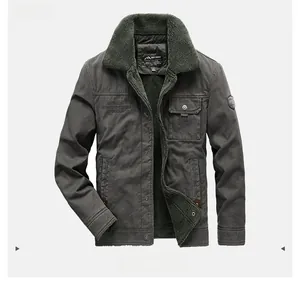 Detail of army green winter jacket with plush fleece collar and vintage embroidery