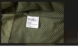 Close-up of olive green jacket interior with breathable mesh and fabric care label
