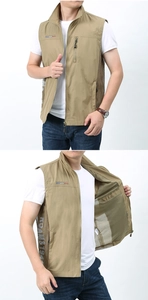 Macro shot of khaki outdoor vest showing mesh lining, zipper pocket and inner structure