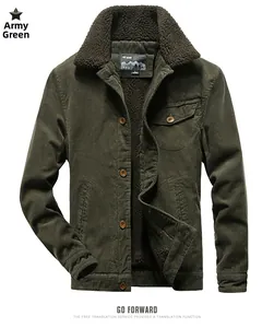 Detail of army green corduroy jacket with brown sherpa collar and buttoned chest pocket