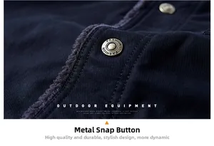 Macro detail of metal snap buttons and warm fleece lining on a winter jacket