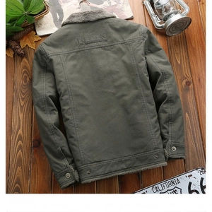 Back view of army green winter jacket with plush collar and fashion leather patch on wood