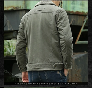 Detail of army green canvas jacket featuring sherpa fleece collar and leather back patch