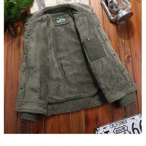 Detail of army green men's jacket showing thick fleece lining and inner utility pocket