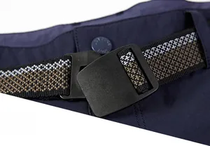 Macro detail of men's quick-dry shorts featuring a woven striped belt and outdoor sport button