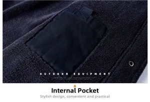 Detail of winter jacket fleece lining with a durable black internal pocket and metal snap