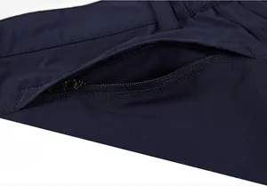 Detail of navy blue quick-dry shorts featuring a practical back pocket with a secure zipper