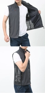 Detail of grey mesh outdoor vest showing breathable side panel and interior lining