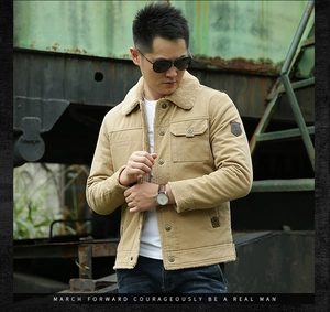 Detail of khaki men's winter jacket with warm sherpa collar and metallic buttons