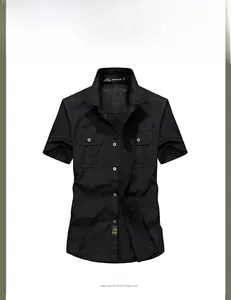 Detail of black short-sleeved cotton shirt showing front pockets and button closure