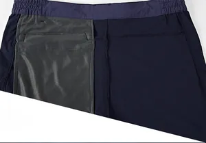Detailed close-up of quick-dry shorts featuring an elastic waistband and mesh inner pocket