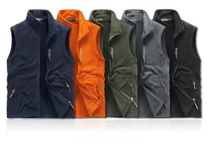 Detailed stack of colorful fleece vests showing navy, orange, green, grey, and black colors