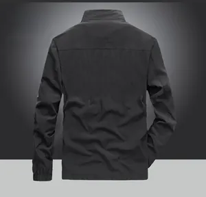 Rear view of dark windproof jacket with climbing-inspired cut and flexible stretch material