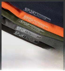 Macro detail of multi-color outdoor fleece material with sport outdoor embroidery