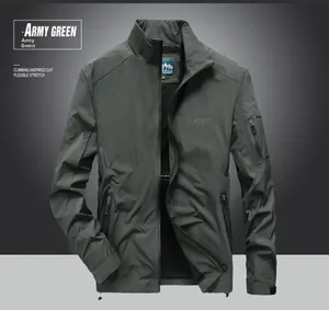 Detail of army green windproof jacket showing stand collar and functional zip pockets