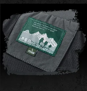 Detail of outdoor sports embroidery patch on high-stretch breathable gray jacket fabric