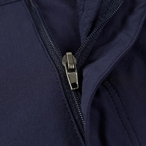 Detail of high-quality metal zipper on navy blue quick-dry summer sports shorts
