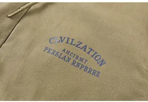 Detail of khaki heavy canvas fabric with blue Civilization print and metal drawstring