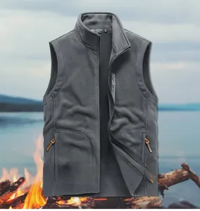 Detail of grey men's fleece vest featuring zip pockets and outdoor sport embroidery
