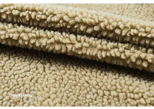 Close-up detail of the warm and thick beige plush fleece lining for winter jackets
