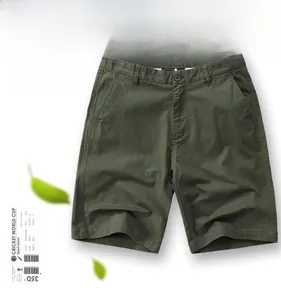 Detail of olive green cotton twill shorts with button fly and side pockets on white background