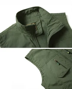 Detail of army green utility vest featuring breathable mesh lining and zipper pockets