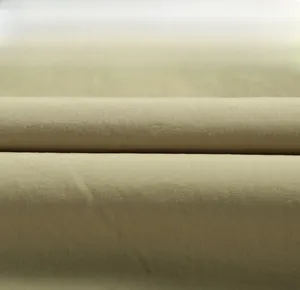 Close-up of olive green twill cotton fabric texture for outdoor utility fishing vest