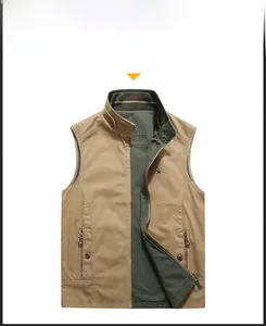 Detail view of khaki outdoor vest with stand collar, metal zipper, and green lining